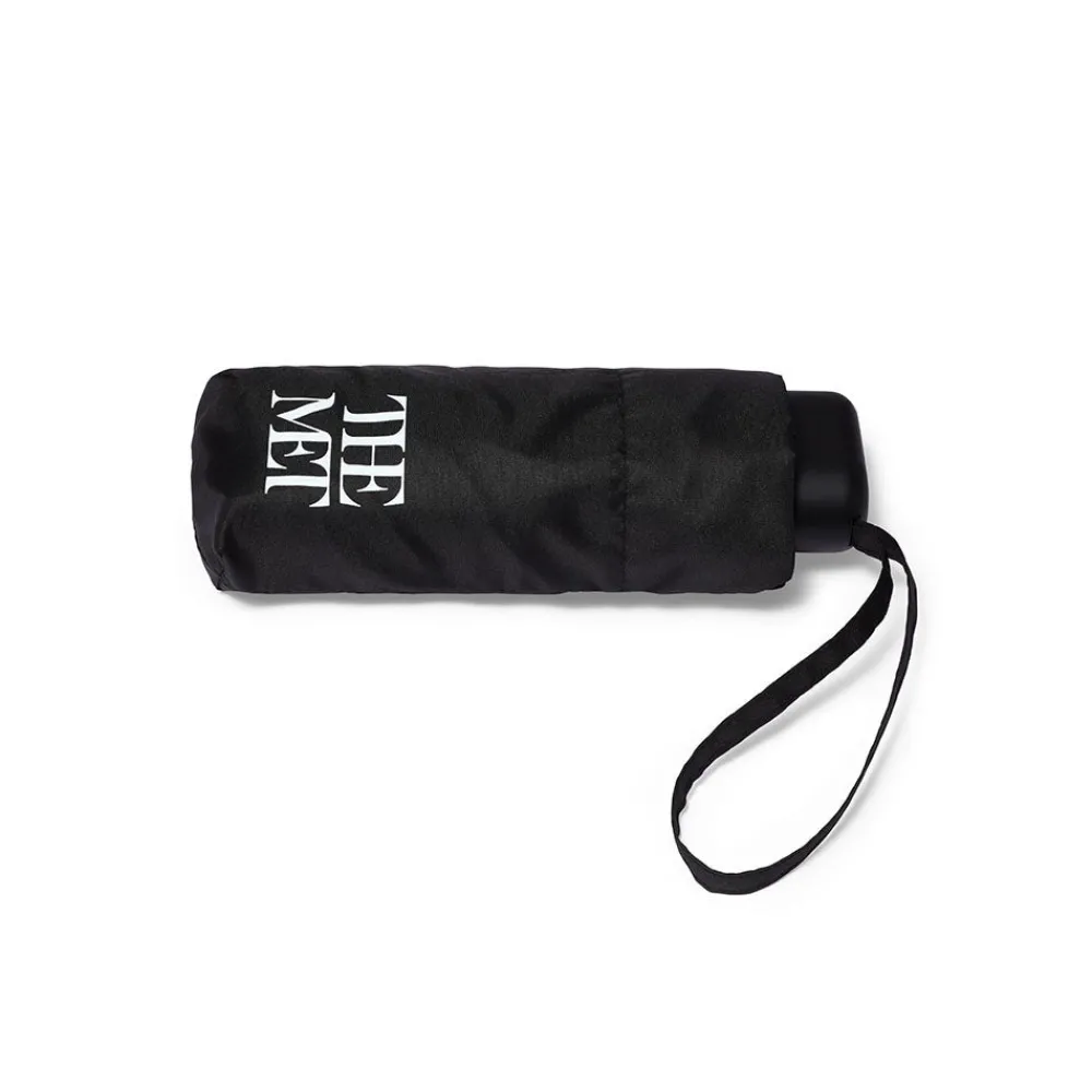 met_logo_folding_umbrella_1.webp Met Logo Folding Umbrella*The Met Store New